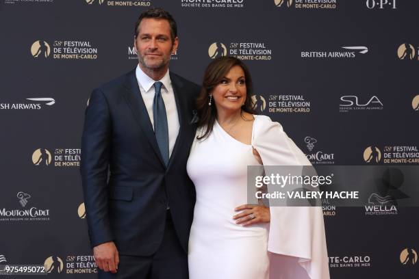 Actor Peter Hermann and US actress Mariska Hargitay pose during the opening of the 58th Monte-Carlo Television Festival on June 15, 2018 in Monaco.