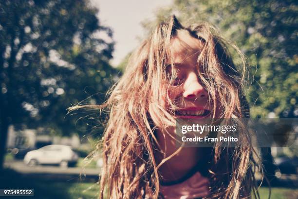 a girl laughing. - cabello desmelenado fotografías e imágenes de stock