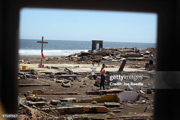 Cross marks the spot where a hostel stood before it was destroyed by the massive earthquake and tsunami on March 8, 2010 in Pelluhue, Chile....
