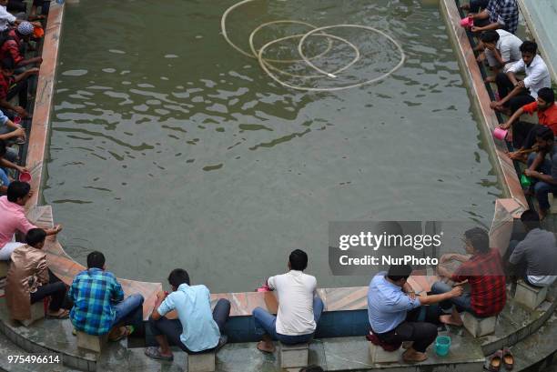 Nepalese Muslims washes their hands, face and feet before offering ritual prayers during last friday of Ramadan at Nepali Jame mosque at Kathmandu,...