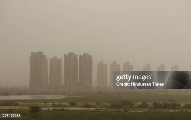 An apparent dust cloud has enveloped high-rise buildings completely at Sector 101 pressing an alarming button, on June 15, 2018 in Gurugram, India....