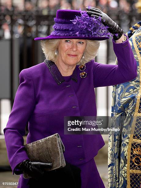 Camilla Duchess of Cornwall holds onto her hat in the high wind as she attends the Commonwealth Day Observance Service at Westminster Abbey on March...