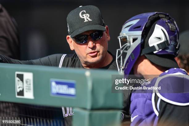 Bud Black of the Colorado Rockies has a few words with Tony Wolters in the first inning of a game against the Arizona Diamondbacks at Coors Field on...