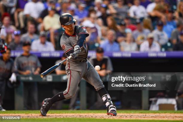 John Ryan Murphy of the Arizona Diamondbacks hits a single in the eighth inning of a game against the Colorado Rockies at Coors Field on June 9, 2018...