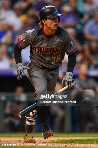 John Ryan Murphy of the Arizona Diamondbacks hits a single in the eighth inning of a game against the Colorado Rockies at Coors Field on June 9, 2018...