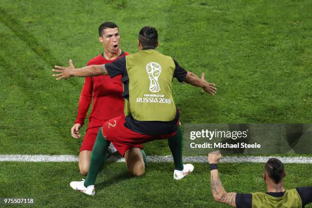 Cristiano Ronaldo of Portugal celebrates scoring his side's second goal with team mate Bruno Alves during the 2018 FIFA World Cup Russia group B...