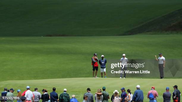 Henrik Stenson of Sweden and Martin Kaymer of Germany wait on the 16th green during the second round of the 2018 U.S. Open at Shinnecock Hills Golf...