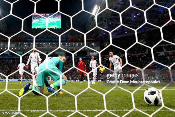 Cristiano Ronaldo of Portugal scores his team's second goal past David De Gea of Spain during the 2018 FIFA World Cup Russia group B match between...