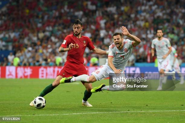 Nacho of Spain is challenged by Bruno Fernandes of Portugal during the 2018 FIFA World Cup Russia group B match between Portugal and Spain at Fisht...