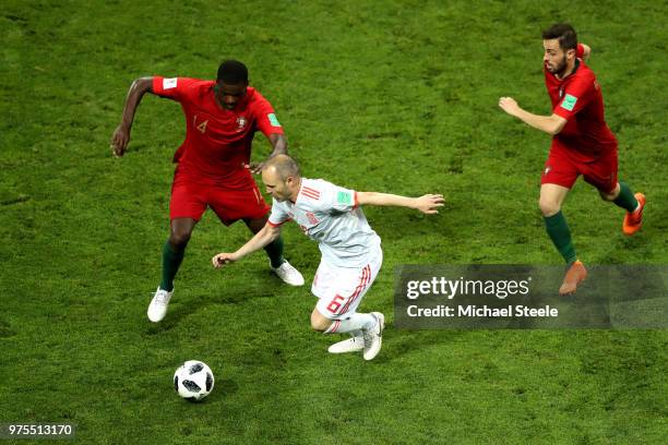 Andres Iniesta of Spain is challenged by Bruno Fernandes of Portugal during the 2018 FIFA World Cup Russia group B match between Portugal and Spain...