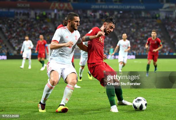 Bruno Fernandes of Portugal is challenged by Koke of Spain during the 2018 FIFA World Cup Russia group B match between Portugal and Spain at Fisht...