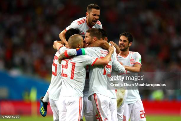 Diego Costa of Spain celebrates with team mates after scoring his team's second goal during the 2018 FIFA World Cup Russia group B match between...