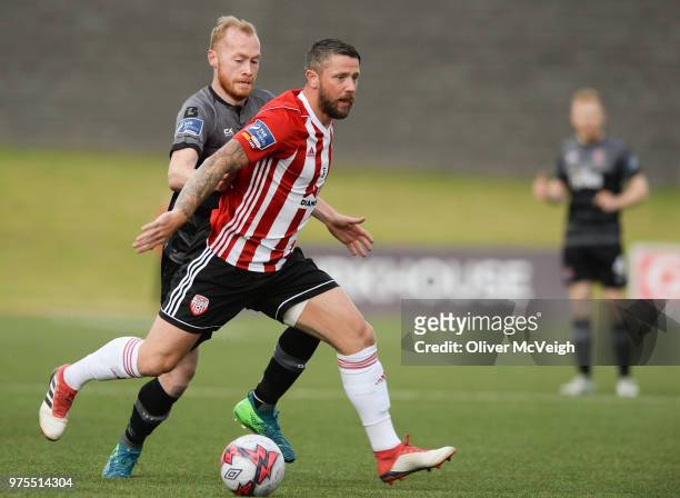 Londonderry , United Kingdom - 15 June 2018; Rory Patterson of Derry City in action against Chris Sheilds of Dundalk during the SSE Airtricity League...