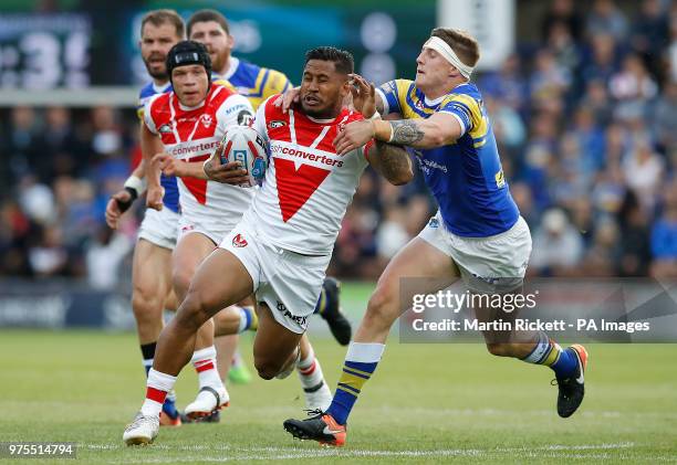 St Helens' Ben Barba is tackled by Leeds Rhinos Liam Sutcliffe during the Betfred Super League match at Headingley Stadium, Leeds.