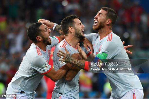 Spain's defender Nacho Fernandez celebrates a goal with Spain's midfielder Koke and Spain's defender Sergio Ramos during the Russia 2018 World Cup...