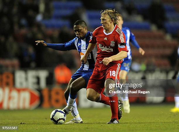 Charles N'Zogbia of Wigan battles Dirk Kuyt of Liverpool during the Barclays Premier League match between Wigan Athletic and Liverpool at the DW...