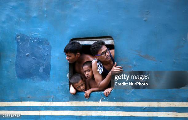 Roofs of trains too get crammed as they reach airport station in Dhaka on Friday, 15 June 2018.Roofs of trains too get crammed as they reach airport...