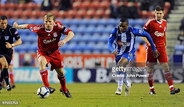 Dirk Kuyt of Liverpool runs away from Charles N'Zogbia of Wigan during the Barclays Premier League match between Wigan Athletic and Liverpool at the...