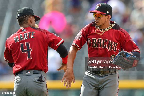 Ketel Marte and Jon Jay of the Arizona Diamondbacks celebrate after an 8-3 win over the Colorado Rockies at Coors Field on June 10, 2018 in Denver,...