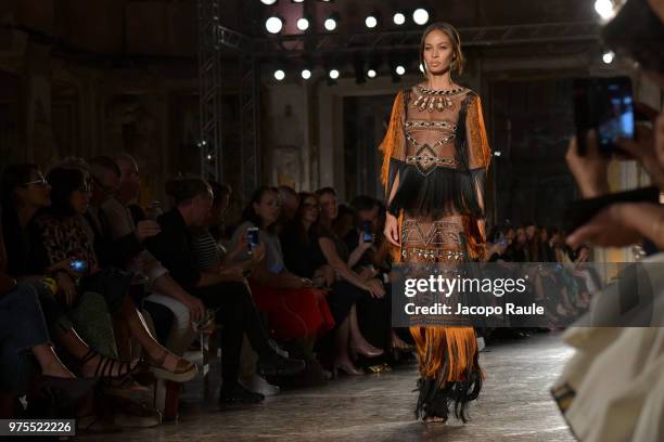 Joan Smalls walks the runway at the Alberta Ferretti Resort 2019 show during Milan Men's Fashion Week Spring/Summer 2019 on June 15, 2018 in Milan,...