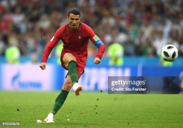 Cristiano Ronaldo of Portugal scores his team's third goal during the 2018 FIFA World Cup Russia group B match between Portugal and Spain at Fisht...