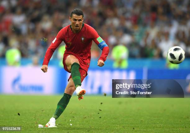 Cristiano Ronaldo of Portugal scores his team's third goal during the 2018 FIFA World Cup Russia group B match between Portugal and Spain at Fisht...