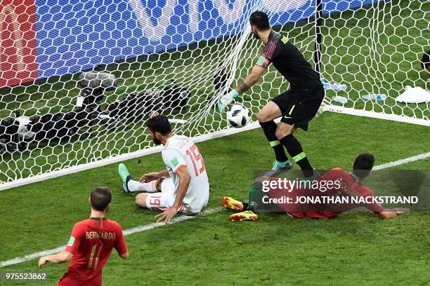Spain's forward Diego Costa scores his second goal next to Portugal's goalkeeper Rui Patricio during the Russia 2018 World Cup Group B football match...