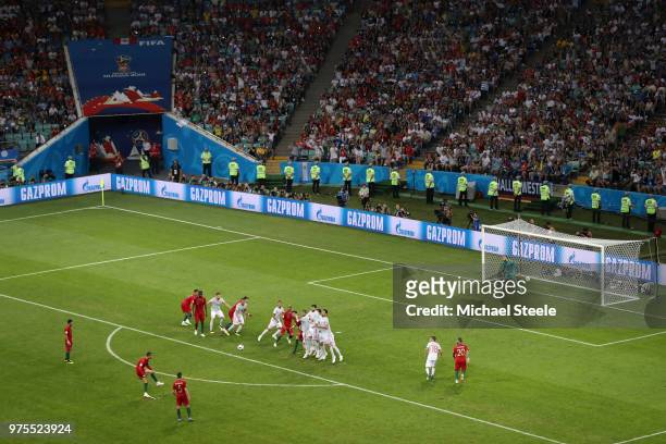 Cristiano Ronaldo of Portugal scores a free-kick for his team's third goal during the 2018 FIFA World Cup Russia group B match between Portugal and...