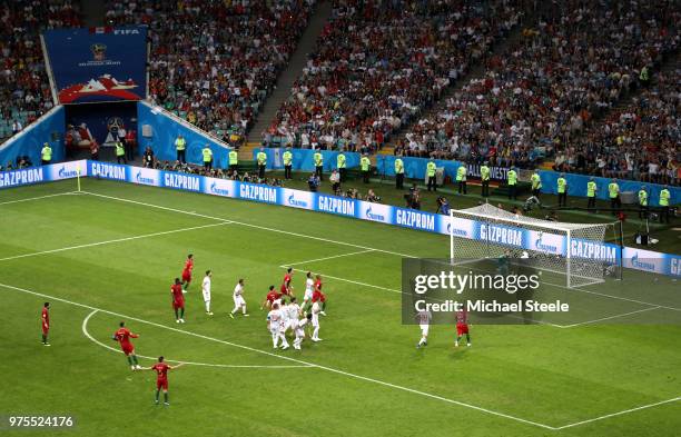 Cristiano Ronaldo of Portugal scores a free-kick for his team's third goal during the 2018 FIFA World Cup Russia group B match between Portugal and...