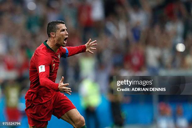 Portugal's forward Cristiano Ronaldo celebrates scoring his third goal during the Russia 2018 World Cup Group B football match between Portugal and...