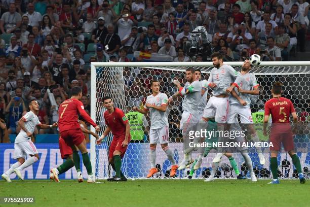 Portugal's forward Cristiano Ronaldo shoots to score his third goal during the Russia 2018 World Cup Group B football match between Portugal and...