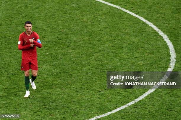 Portugal's forward Cristiano Ronaldo celebrates at the end of the Russia 2018 World Cup Group B football match between Portugal and Spain at the...