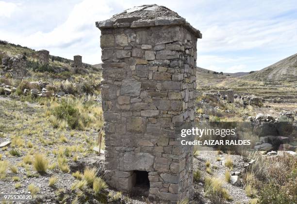 Picture of a restored pre-Inca funerary tower known as chullpa, erected at the Qala Uta archaeological site near Quehuaya, on the slopes of the hills...