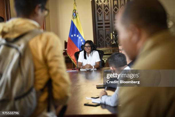 Delcy Rodriguez, Venezuela's vice president, center, smiles during a meeting in Caracas, Venezuela, on Friday, June 15, 2018. Venezuela President...