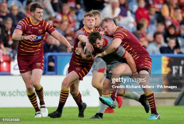 Catalan Dragons Greg Bird is tackled during the Betfred Super League match at the John Smith's Stadium, Huddersfield.