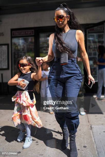 North West and Kim Kardashian are seen in the Meat Packing District on June 15, 2018 in New York City.