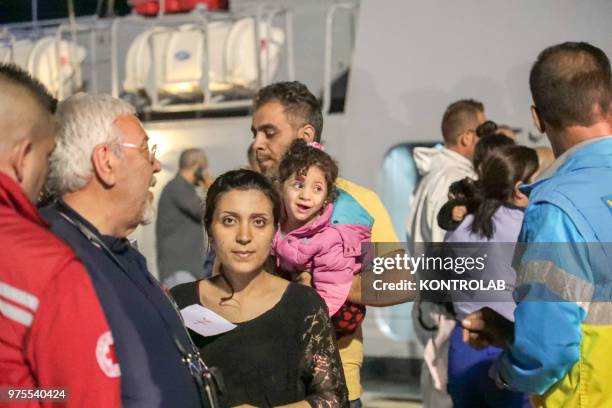 Moment of the landing of 48 Syrian refugees landed at the Port of Crotone in the night, transported by a patrol boat of the Guardia di Finanza of...