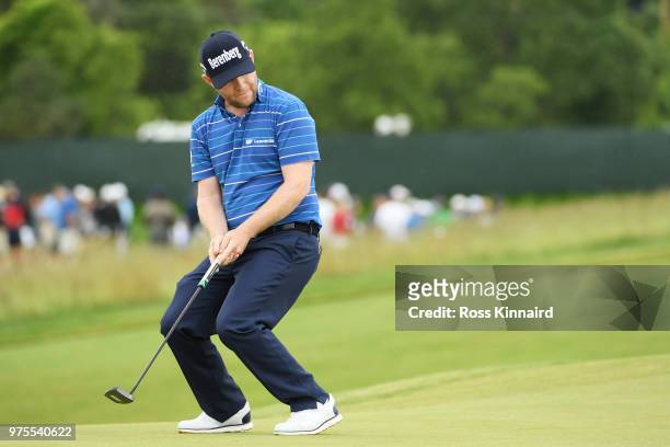 Branden Grace of South Africa reacts to a birdie attempt on the 11th green during the second round of the 2018 U.S. Open at Shinnecock Hills Golf...