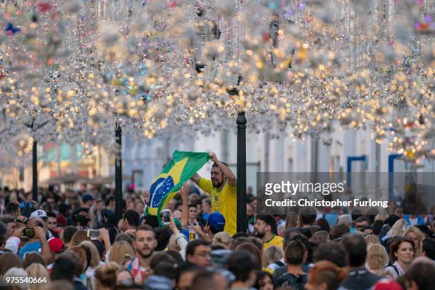 Football fans from Brazil sing songs and enjoy the party atmosphere of The World Cup in Nikolskaya Street, near Red Square on June 15, 2018 in...