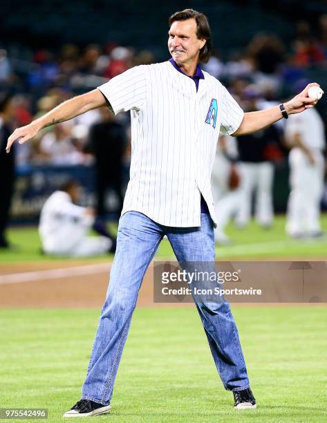 Former against the Arizona Diamondbacks pitcher Randy Johnson throws the first pitch during the MLB baseball game between the Arizona Diamondbacks...