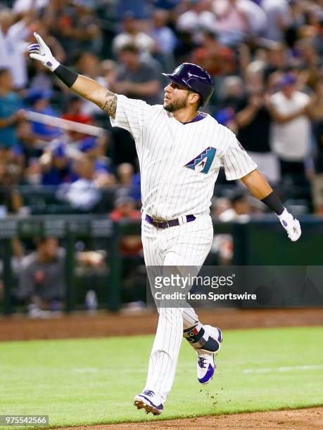 Arizona Diamondbacks right fielder David Peralta celebrates as he runs the bases after hitting a homer during the MLB baseball game between the...