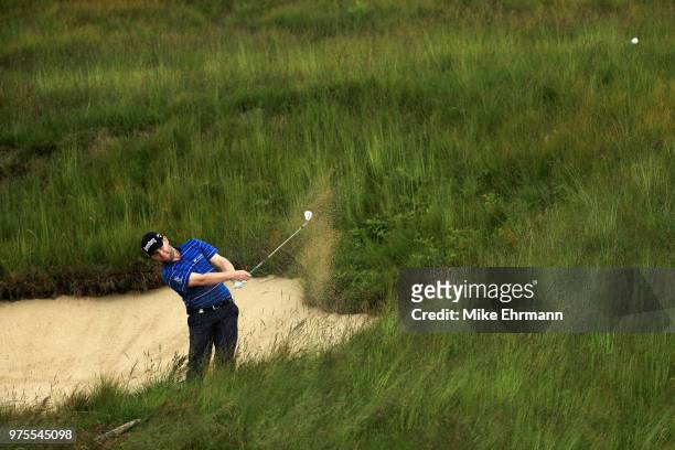 Branden Grace of South Africa plays a shot from a bunker on the tenth hole during the second round of the 2018 U.S. Open at Shinnecock Hills Golf...