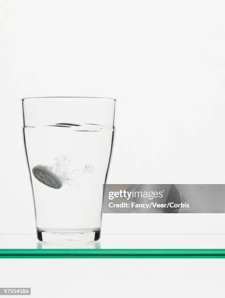 antacid dissolving in water - effervescent tablet stock pictures, royalty-free photos & images