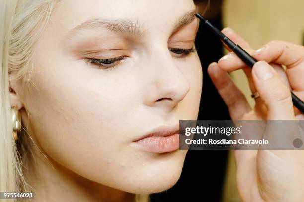 Model is seen backstage ahead of the Alberta Ferretti show during Milan Men's Fashion Week Spring/Summer 2019 on June 15, 2018 in Milan, Italy.