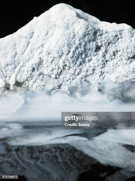 snow covered rock - climat stock pictures, royalty-free photos & images