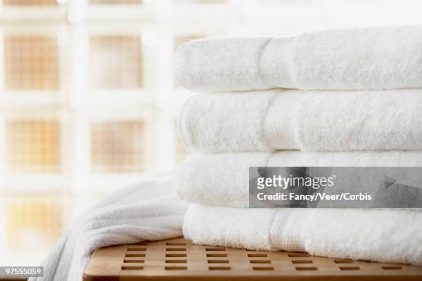 stack of clean bath towels - bath towels stock-fotos und bilder