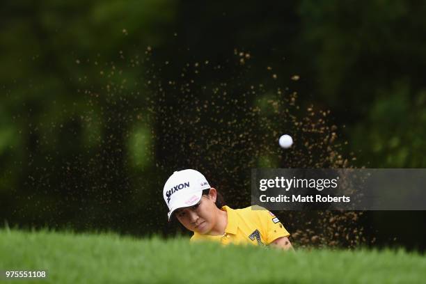 Kotono Kozuma of Japan hits out of the bunker on the 1st hole during the first round of the Nichirei Ladies at the Sodegaura Country Club Shinsode...