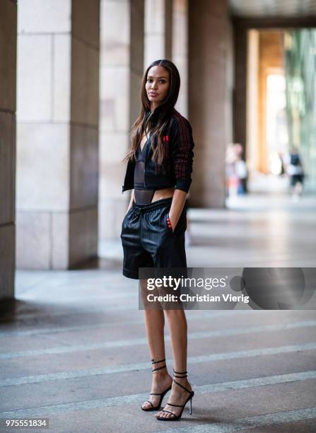 Model Joan Smalls wearing sheer body, jacket, shorts is seen outside Alberta Ferretti during Milan Men's Fashion Week Spring/Summer 2019 on June 15,...