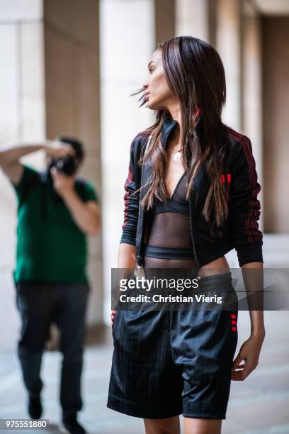 Model Joan Smalls wearing sheer body, jacket, shorts is seen outside Alberta Ferretti during Milan Men's Fashion Week Spring/Summer 2019 on June 15,...