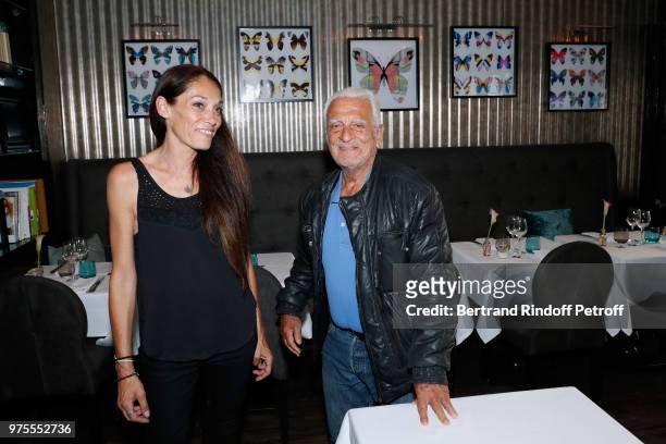 Charlotte Joly and her uncle Alain Belmondo attend the "Street Art butterflies" by Charlotte Joly Exhibition Preview at Veramente, on June 15, 2018...